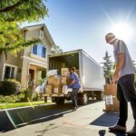 Professional movers packing and loading items into a truck for a local move