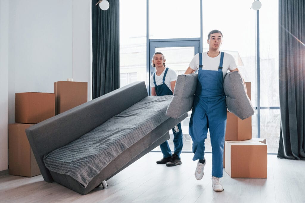movers in abu dhabi - carrying sofa